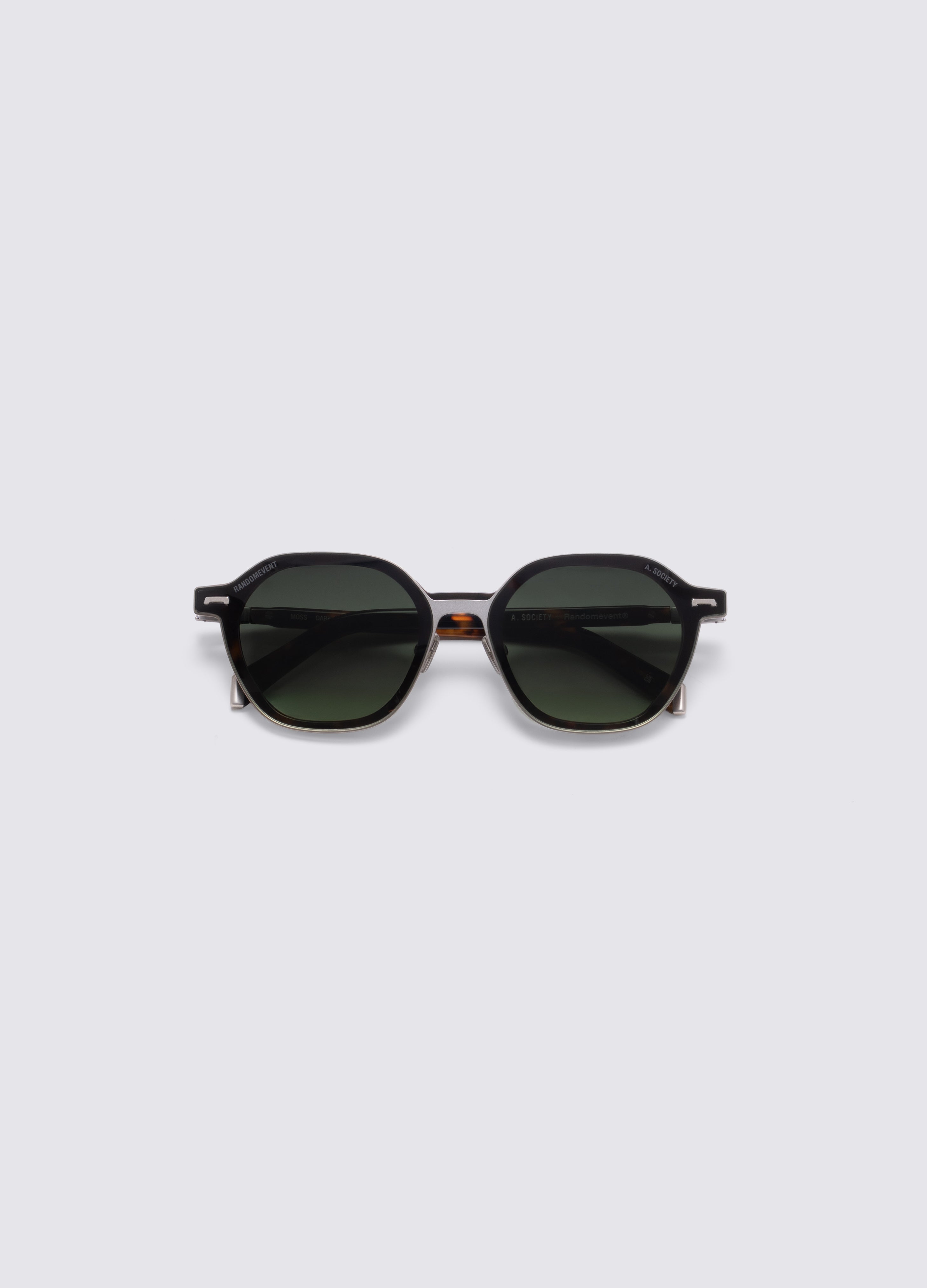 Top-down of a pair of sunglasses with a tortoiseshell acetate frame and dark green gradient lenses, shown on a light gray background. #Dark Havana Silver