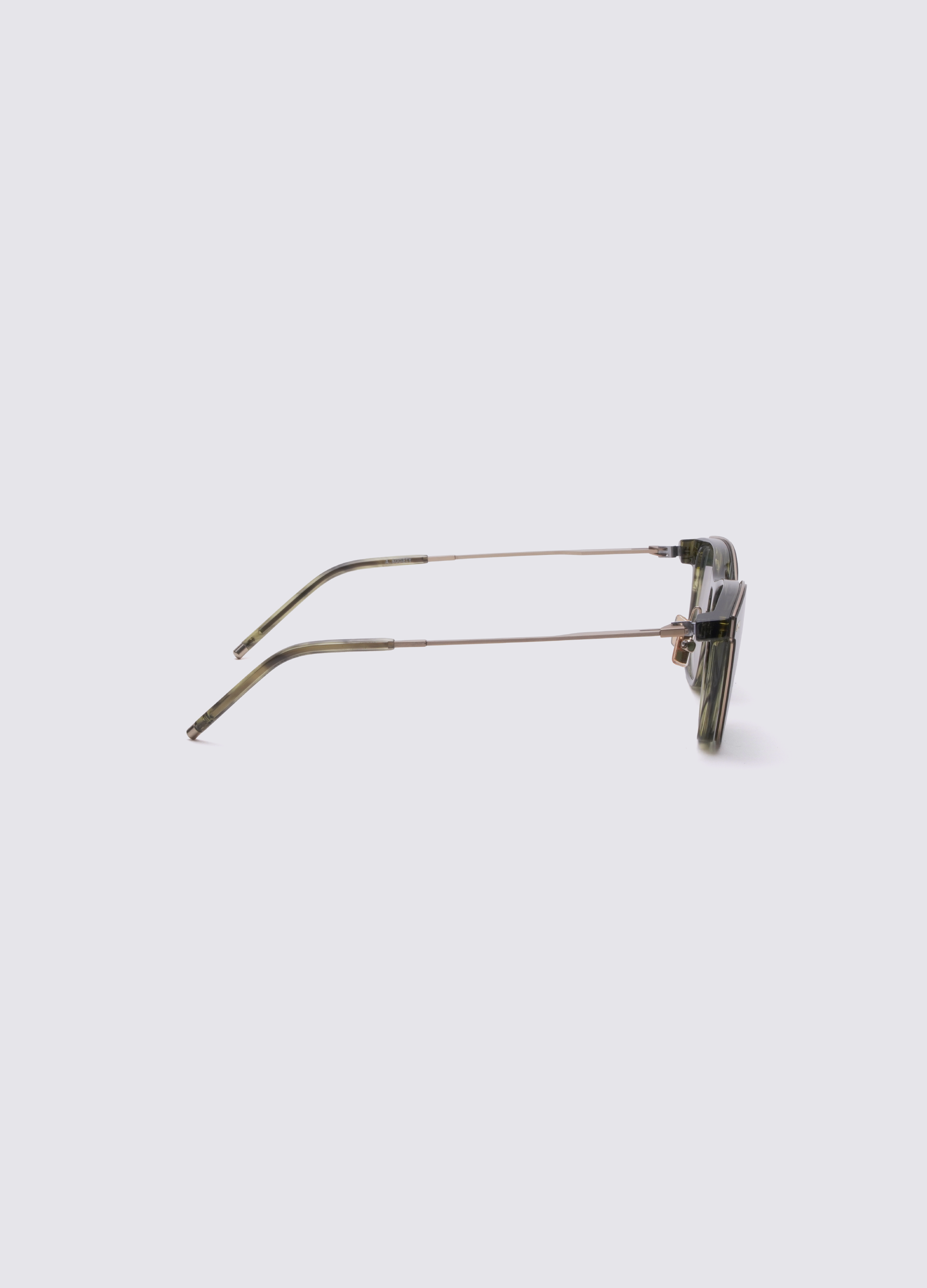 Clip-on glasses with gold frame and dark lenses on a white background  #Green Havana Gold